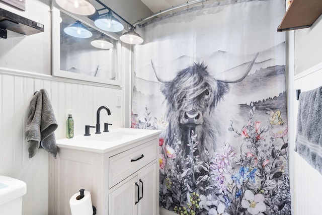 bathroom featuring vanity and a shower with curtain