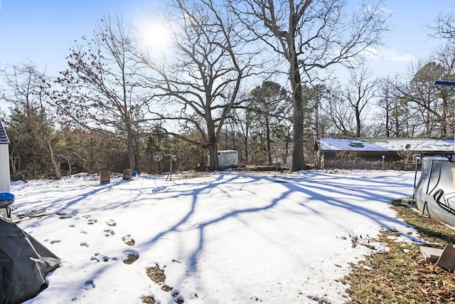 view of yard layered in snow