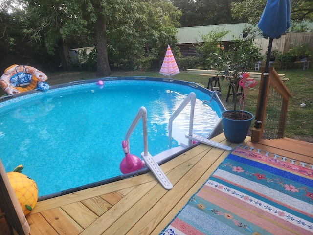 view of pool with a deck