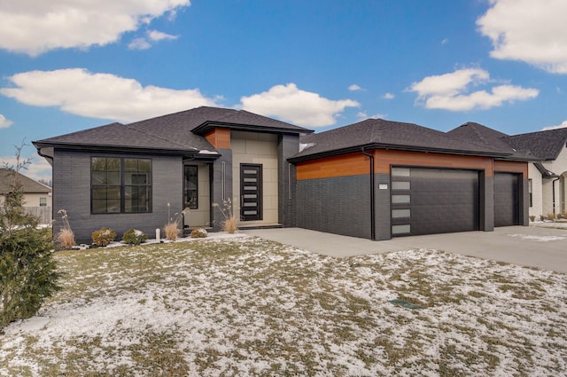 prairie-style home featuring a garage