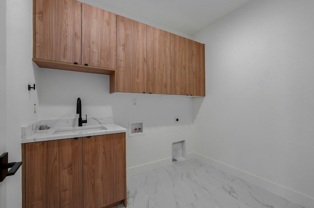 clothes washing area featuring sink, electric dryer hookup, hookup for a washing machine, and cabinets