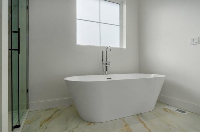 bathroom featuring a tub