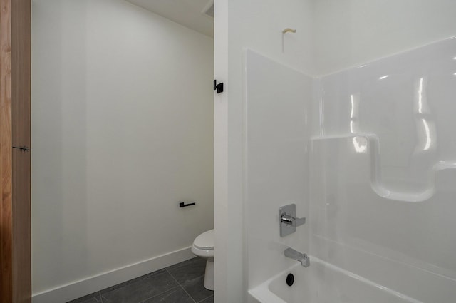 bathroom with toilet, tile patterned floors, and shower / bath combination