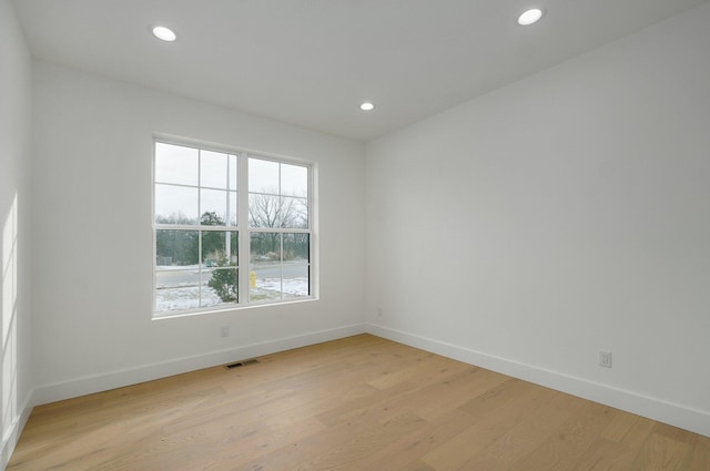 unfurnished room with light hardwood / wood-style flooring