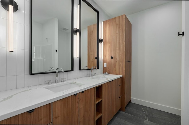 bathroom featuring tile patterned flooring and vanity