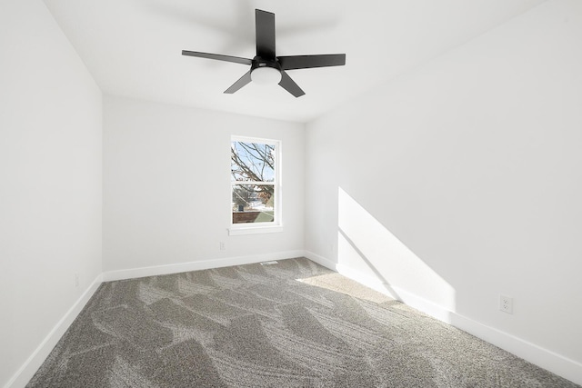 spare room with carpet floors and ceiling fan