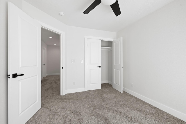 unfurnished bedroom featuring carpet flooring, a closet, and ceiling fan