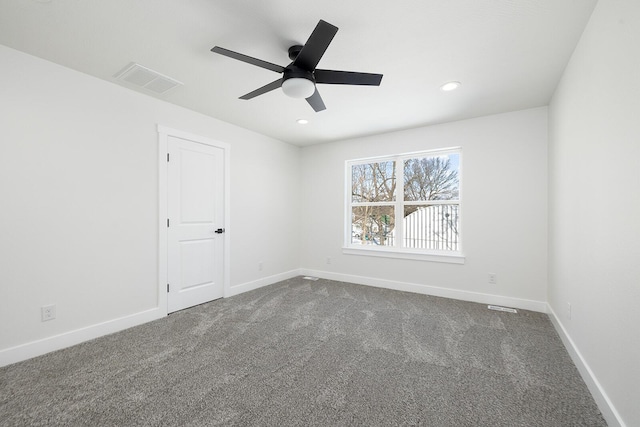 empty room with ceiling fan and carpet floors