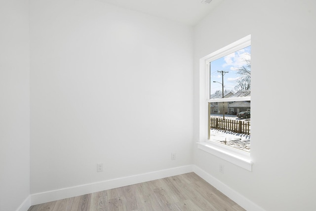 empty room with light hardwood / wood-style floors