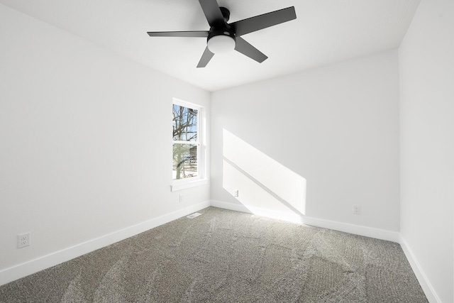 spare room with carpet floors and ceiling fan