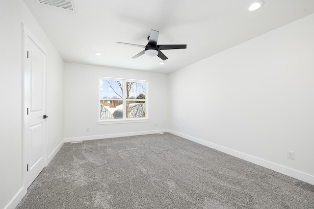 spare room with ceiling fan and carpet flooring