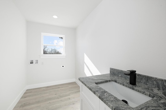 bathroom with vanity and hardwood / wood-style floors