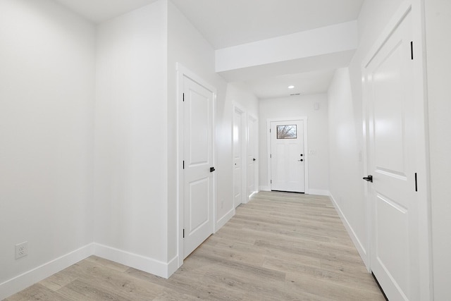 corridor featuring light hardwood / wood-style floors