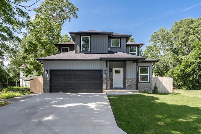 1309 E Blaine St, Springfield, MO 65803 - view of front of house with concrete driveway, stone siding, and a shingled roof