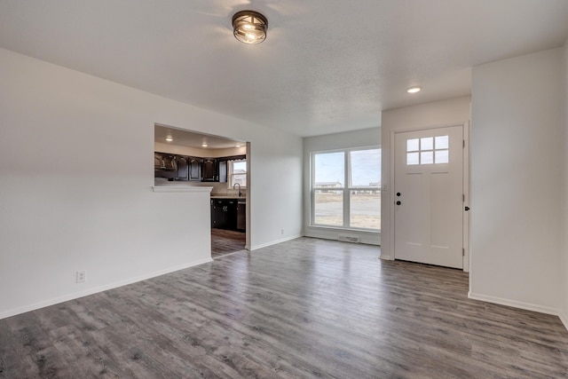 unfurnished living room featuring wood-type flooring