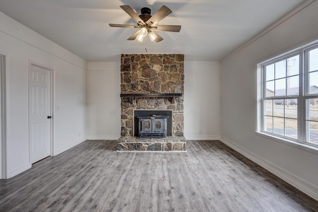 unfurnished living room with ceiling fan and wood-type flooring