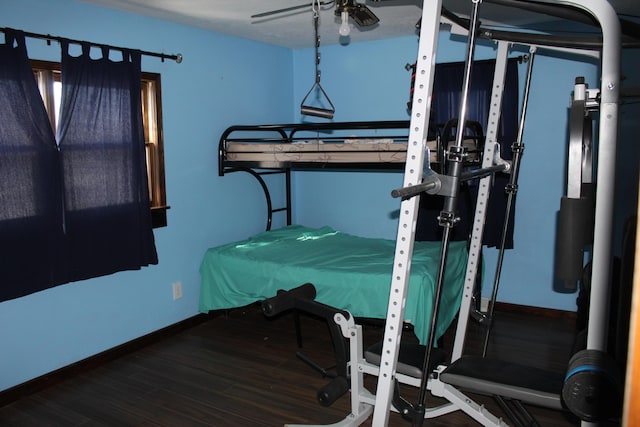 bedroom featuring hardwood / wood-style floors and ceiling fan