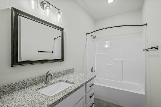 bathroom with vanity and shower / bath combination