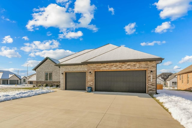 ranch-style home featuring a garage