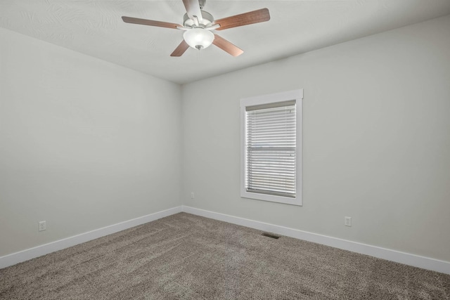 unfurnished room with ceiling fan and carpet flooring