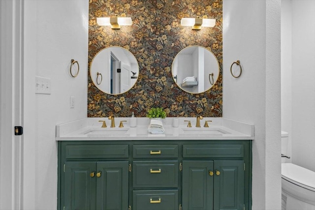 bathroom featuring toilet and vanity