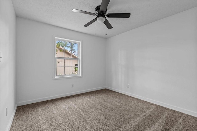 spare room with ceiling fan and carpet flooring