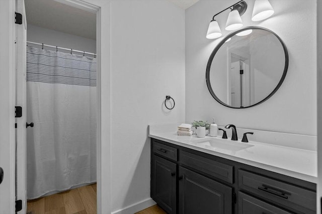 bathroom featuring wood-type flooring and vanity