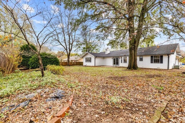 rear view of property featuring central AC