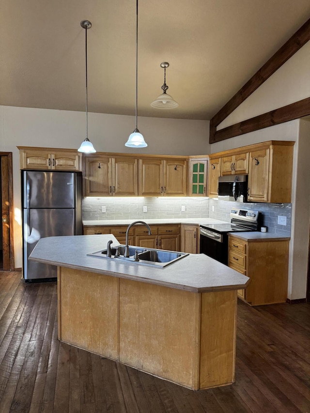 kitchen with sink, decorative light fixtures, vaulted ceiling with beams, a kitchen island with sink, and appliances with stainless steel finishes