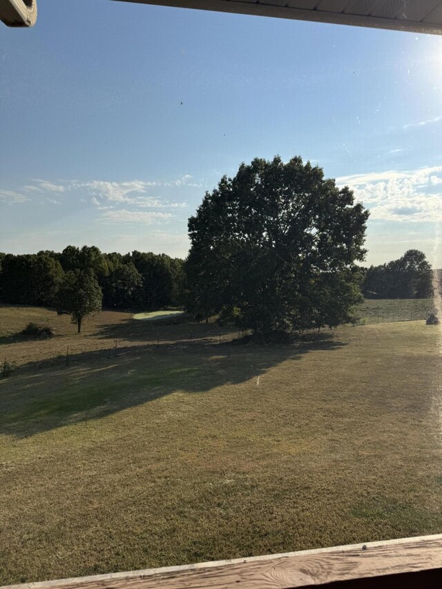 view of yard with a rural view