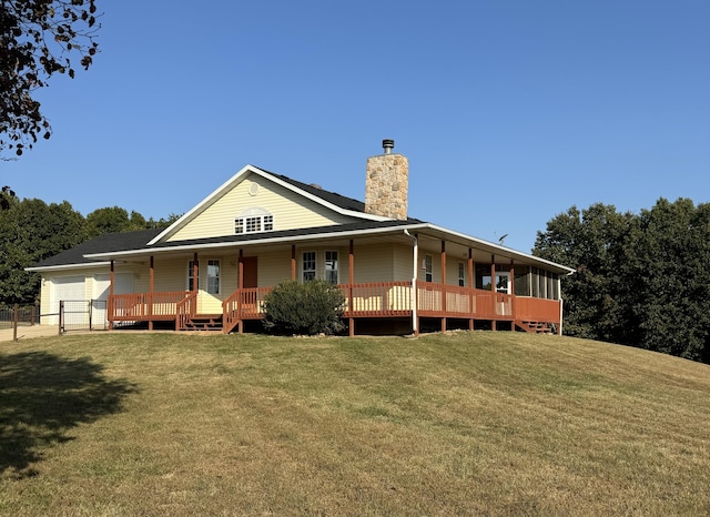 back of property featuring a lawn