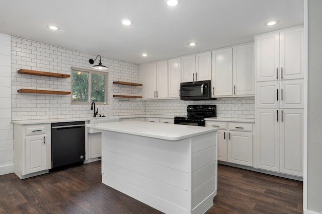 kitchen featuring black appliances, white cabinetry, dark hardwood / wood-style floors, and a kitchen island