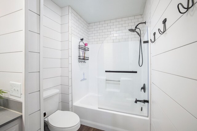 bathroom featuring bathing tub / shower combination and toilet