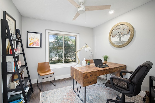 office featuring dark hardwood / wood-style flooring and ceiling fan