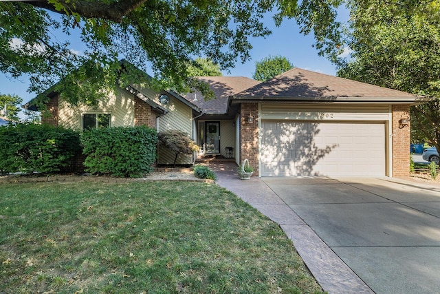 ranch-style home with a garage and a front yard