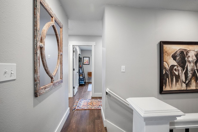 corridor featuring dark wood-type flooring