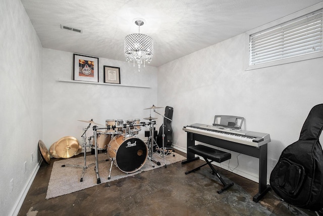 miscellaneous room with a chandelier