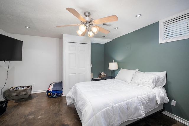 bedroom with ceiling fan, a closet, and a textured ceiling