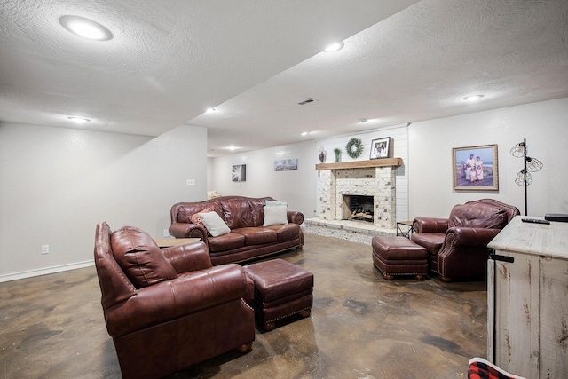 living room with a brick fireplace and a textured ceiling