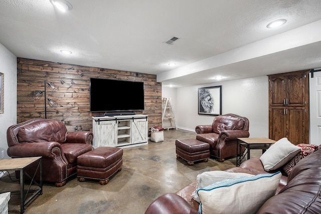 living room with concrete flooring and a textured ceiling