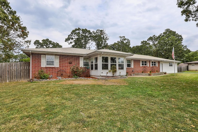 single story home featuring a front yard