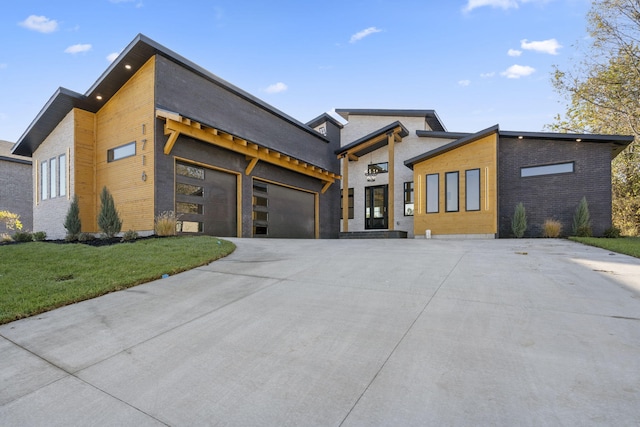 contemporary home with a front lawn