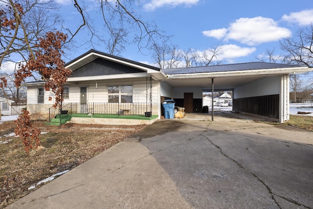 ranch-style home with a carport