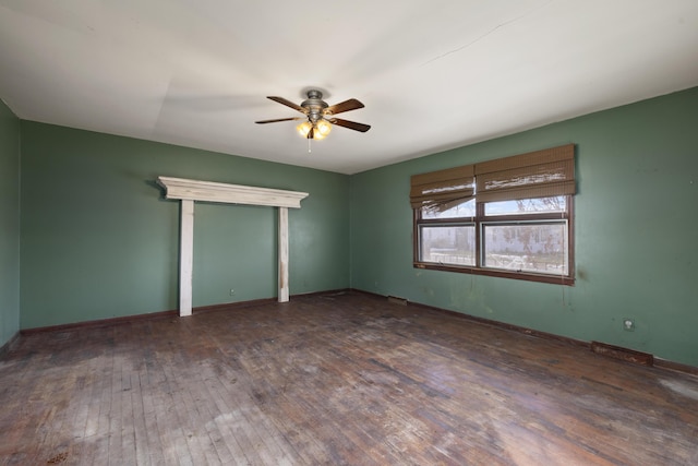 unfurnished room featuring dark hardwood / wood-style flooring and ceiling fan