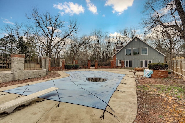 view of pool with a patio and fence private yard