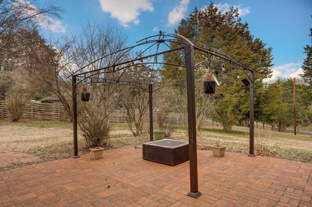 view of patio / terrace featuring fence