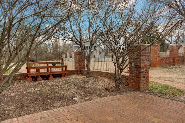 exterior space with a gate and a fenced front yard