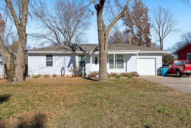 ranch-style house with a garage and a front lawn