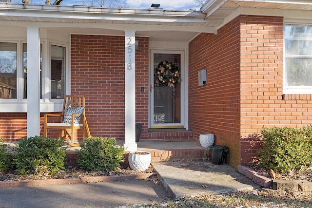 entrance to property with brick siding