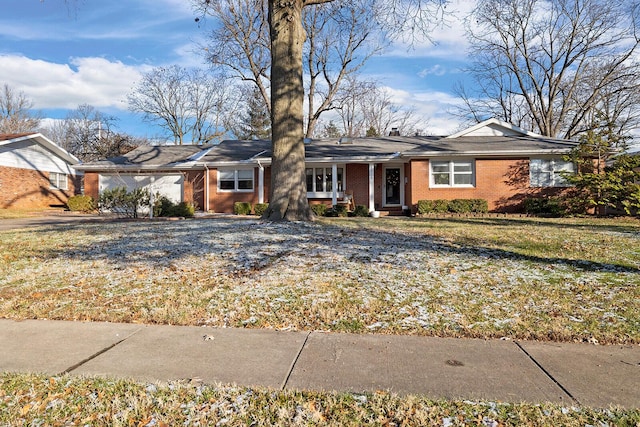 single story home with brick siding and a front lawn